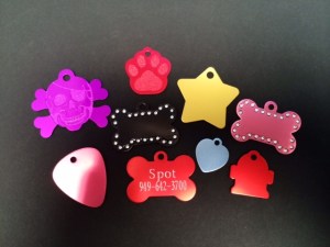 A small sampling of our aluminum pet tags! These tags are offered in many styles, shapes, and colors! Some are even accented with Swarovski elements! These tags can be engraved on one or both sides!